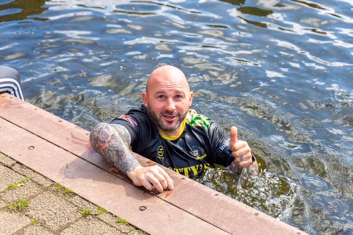 Rick Clements from Fleetwood in the water giving a thumbs up