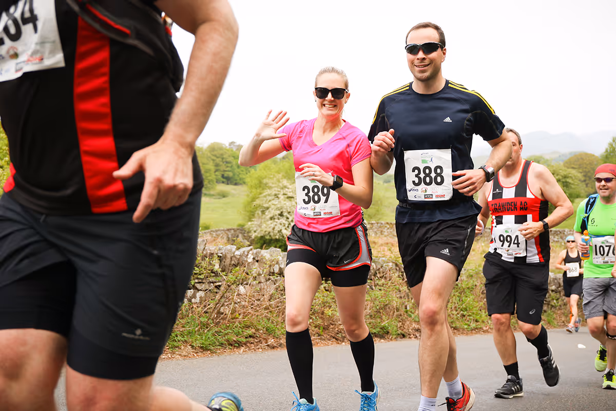 Runners taking part in the Windermere Marathon wave for the camera